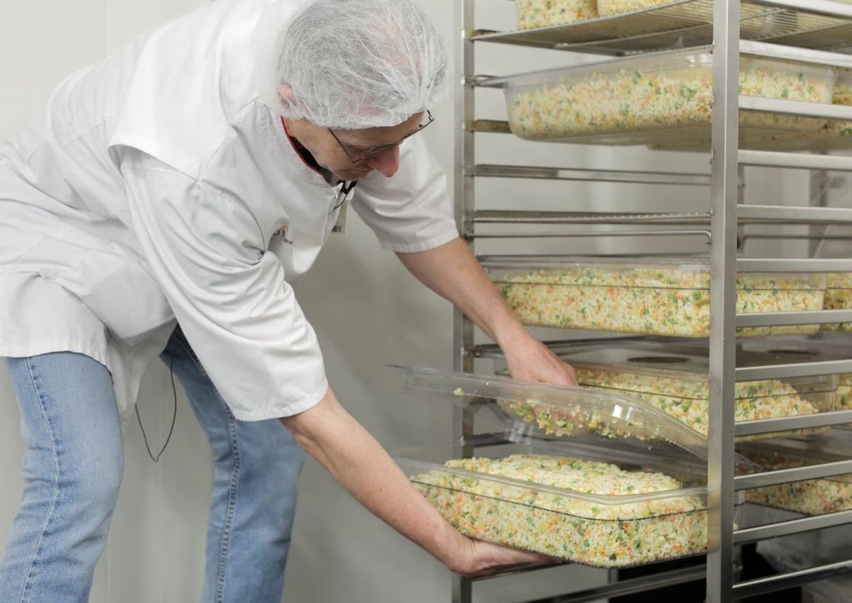 An employee prepares food at AZ Groeninge Hospital in Kortrijk March 13.